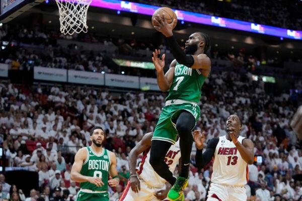 Boston Celtics guard Jaylen Brown (7) drives to the basket over Miami Heat center Bam Adebayo (13) during the second half of Game 4 during the NBA basketball playoffs Eastern Conference finals in Miami on May 23, 2023. (Wilfredo Lee/AP Photo)