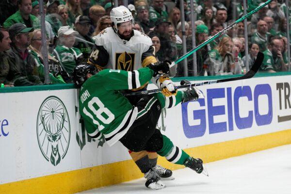 Dallas Stars center Max Domi (18) and Vegas Golden Knights defenseman Nicolas Hague (14) collide along the boards while competing for the puck during the first period of Game 3 of the NHL hockey Stanley Cup Western Conference finals in Dallas on May 23, 2023. (Tony Gutierrez/AP Photo)