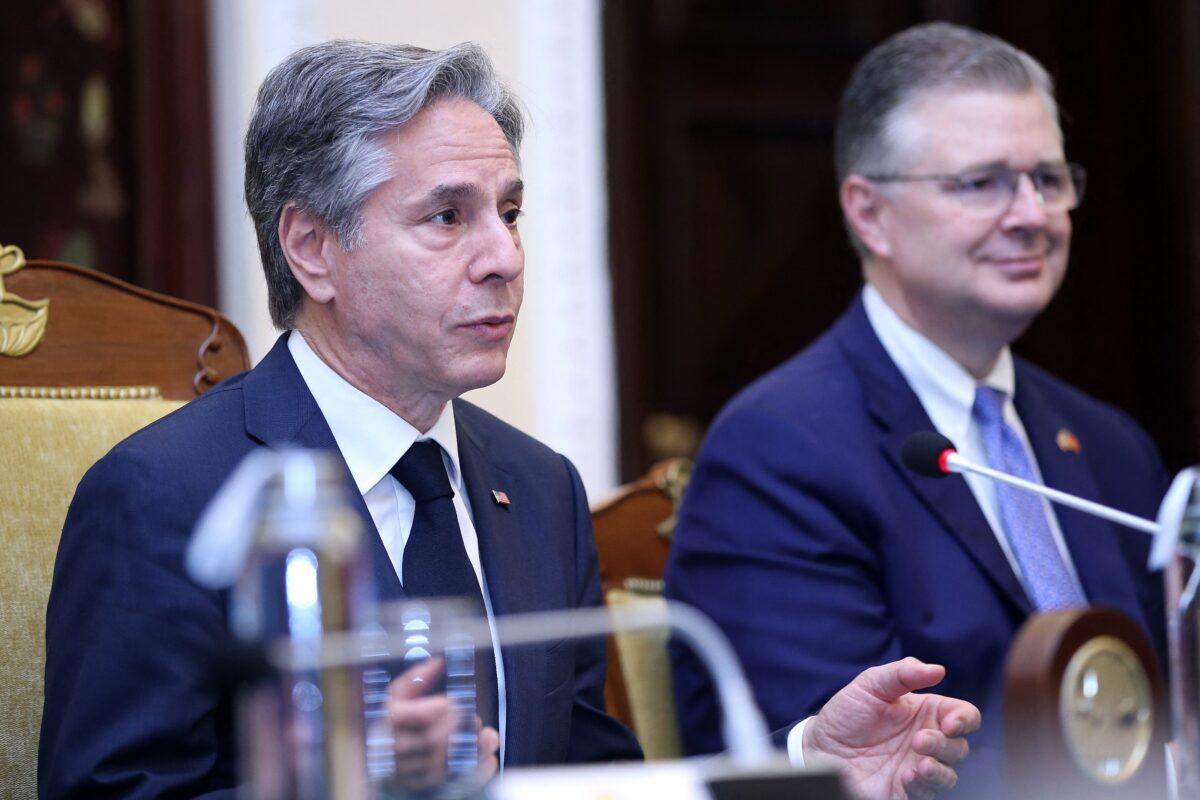 U.S. Secretary of State Antony Blinken (L), accompanied by Assistant Secretary of State for East Asian and Pacific Affairs Daniel Kritenbrink (C), speaks during a meeting with Vietnam's Foreign Minister Bui Thanh Son at the Government Guest House in Hanoi on April 15, 2023. (Luong Thai Linh/AFP via Getty Images)