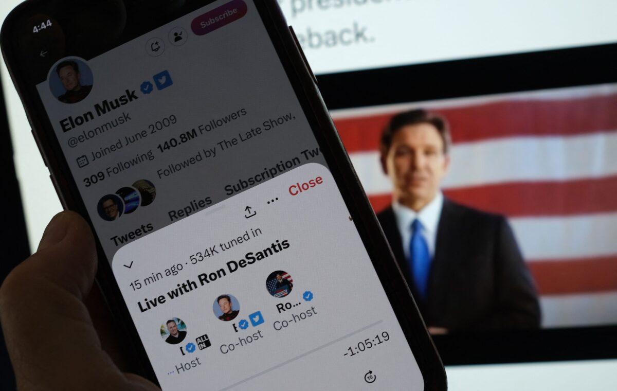 This illustration photo shows the live Twitter talk with Elon Musk on a background of Ron DeSantis as he announces his 2024 presidential run on his Twitter page, on May 24, 2023. (Chris Delmas/AFP via Getty Images)