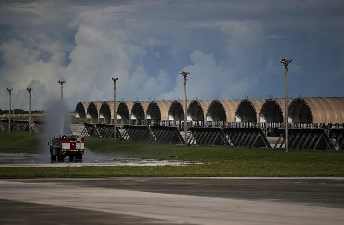 A U.S. Air Force fire truck sprays water near plane hangars at Andersen Air Force base in Yigo, Guam, on Aug 17, 2017. (Justin Sullivan/Getty Images)