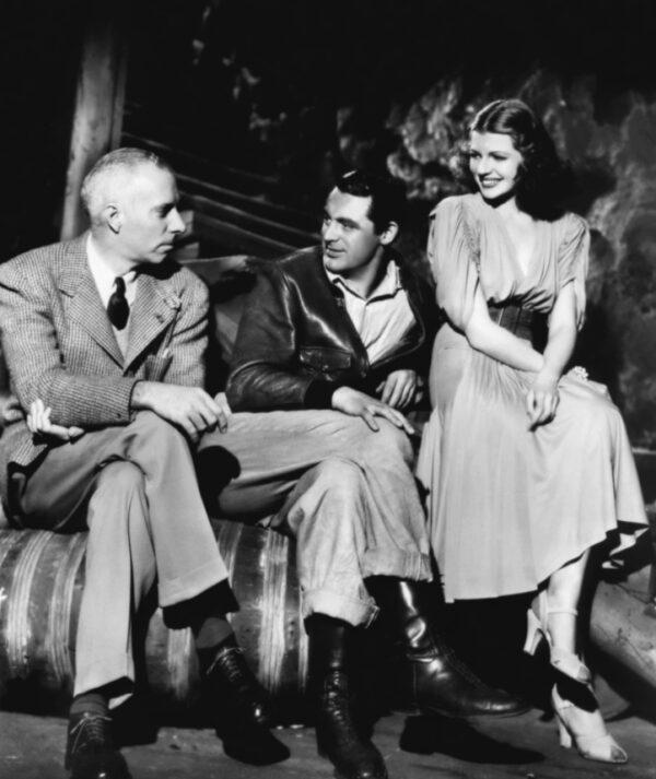 (L–R) Director Howard Hawks, Cary Grant, and Rita Hayworth, on the set of "Only Angels Have Wings." (MovieStillsDB)