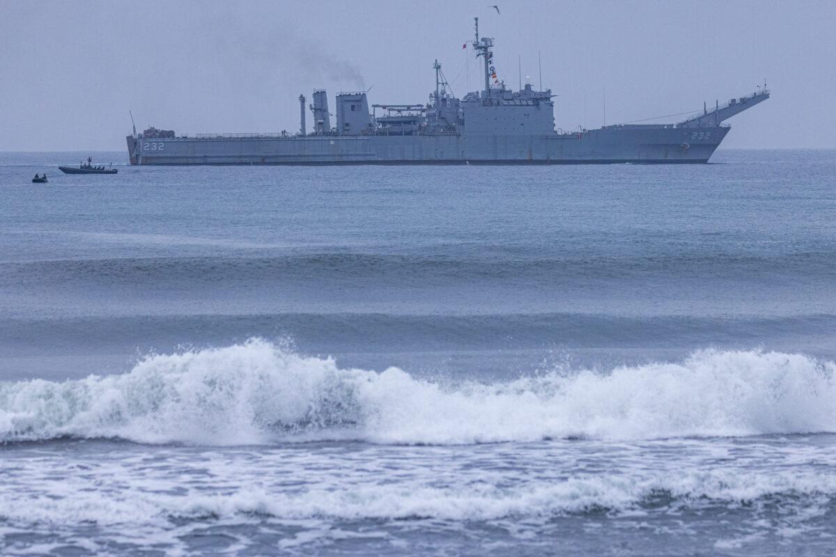 Taiwanese Navy personnel maneuver around a Newport-class tank landing ship in Yilan, Taiwan, on May 24, 2023. (Annabelle Chih/Getty Images)