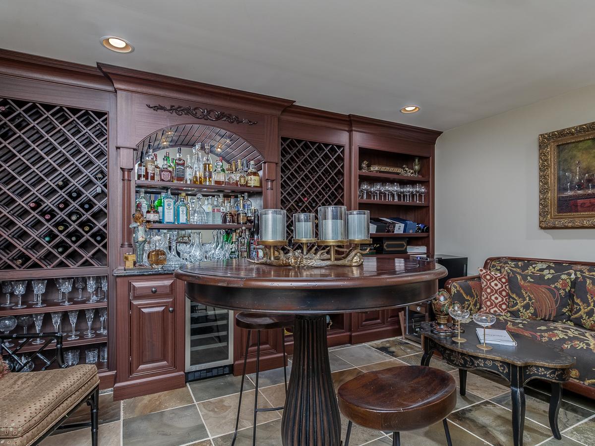 One room in the spacious home is set up for entertaining, complete with a custom bar and wine storage facilities. (Charlotte Virtual Home Tours/Premier Sotheby’s International Realty)
