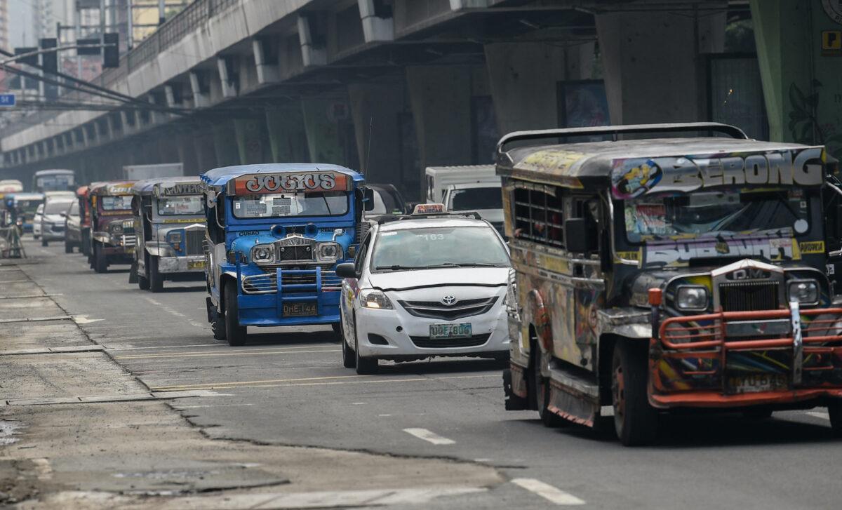 Passenger jeepneys commute along a road in Manila on Sept. 7, 2021. (Ted Aljibe/AFP via Getty Images)