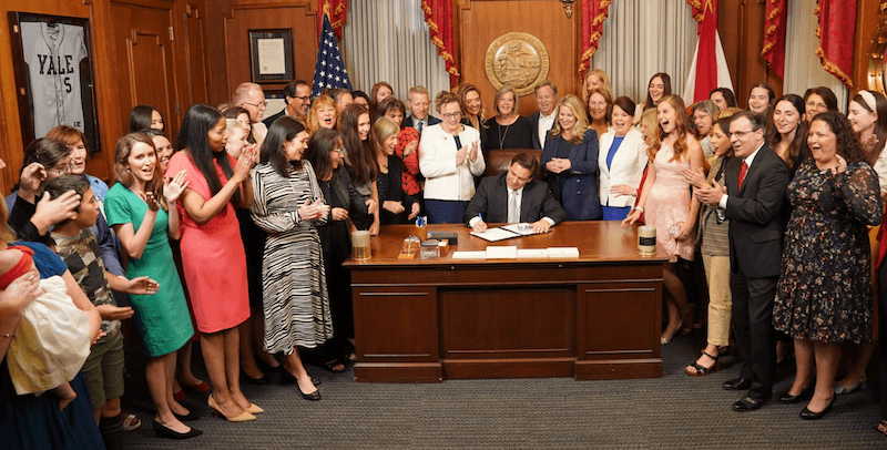 Florida Gov. Ron DeSantis signs the newly-adopted Florida Heartbeat Protection Act, which prohibits abortions once the unborn child has a detectible heartbeat, in Tallahassee on April 13, 2023. (Courtesy of the Florida Governor’s Office.)