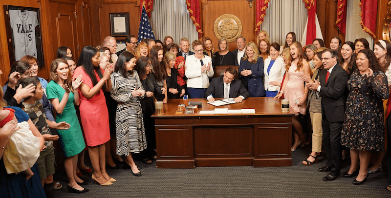 Florida Gov. Ron DeSantis signs the newly adopted Florida Heartbeat Protection Act on April 13, 2023. (Courtesy of the Florida Governorâs Office)