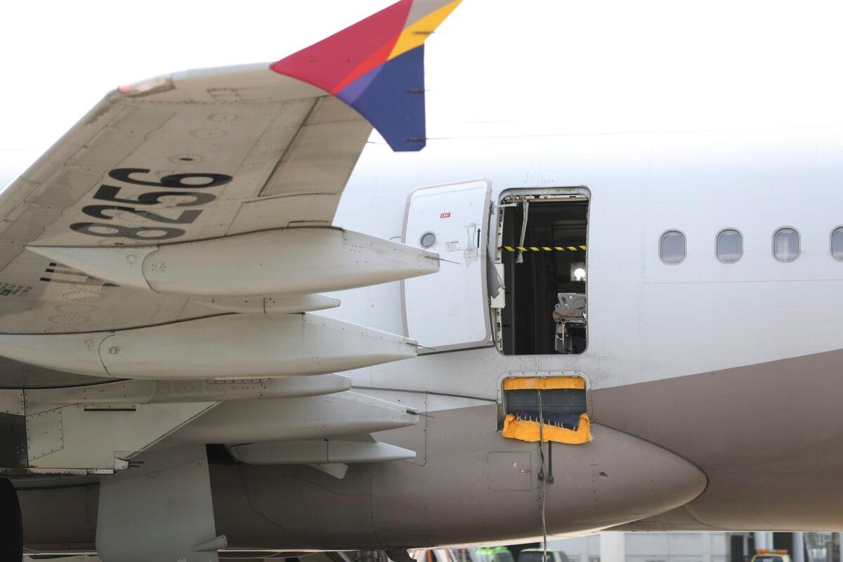An Asiana Airlines plane is parked as one of the plane's doors suddenly opened at Daegu International Airport in Daegu, South Korea, on May 26, 2023. (Yun Kwan-shick/Yonhap via AP)