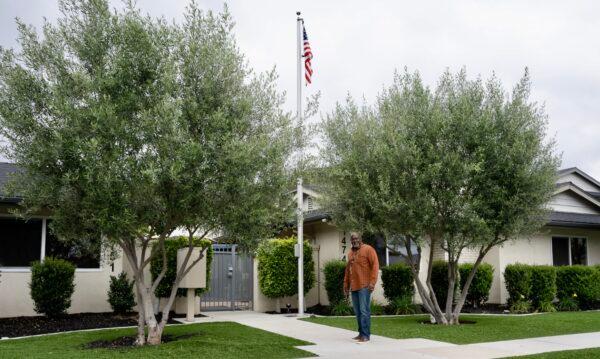 Derrick Burton, pastor and program director at the Christian-based nonprofit Tustin Veterans Outpost run by the Orange County Rescue Mission, stands in front of the outpost's facility in Tustin, Calif., on May 25, 2023. (Rudy Blalock/The Epoch Times)
