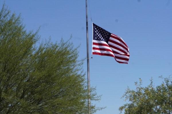 A flag stands at half-staff for Memorial Day at the Arizona Veterans' Memorial Cemetery on May 27, 2023. (Allan Stein/The Epoch Times)