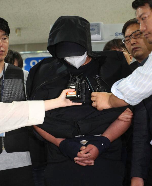 A man who opened an emergency exit door during a flight, arrives to attend an arrest warrant review at the Daegu District Court in Daegu, South Korea, on May 28, 2023. (Yun Kwan-shick/Yonhap via AP)