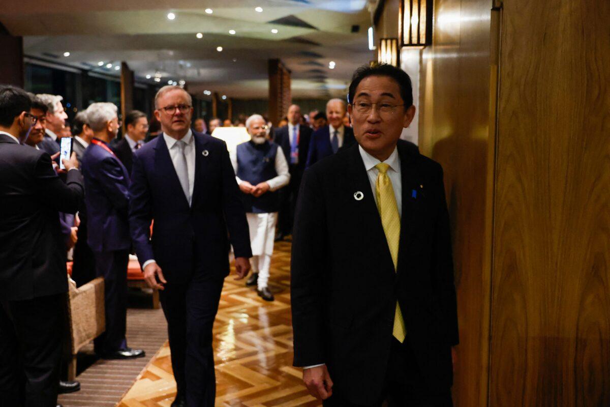 Japan's Prime Minister Fumio Kishida (R), Australia's Prime Minister Anthony Albanese, US President Joe Biden (back R) and India's Prime Minister Narendra Modi (back L) arrive for a quad meeting held on May 20, 2023, on the sidelines of the G7 Leaders' Summit. (Jonathan Ernst/Getty Images)