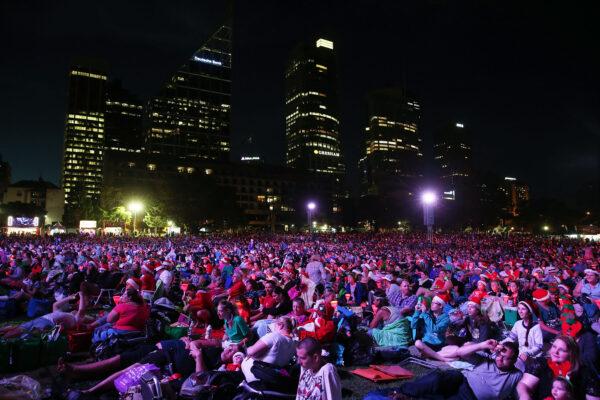Crowd gather at night during Woolworths Carols in the Domain in Sydney, Australia, on Dec. 19, 2015. (Brendon Thorne/Getty Images)