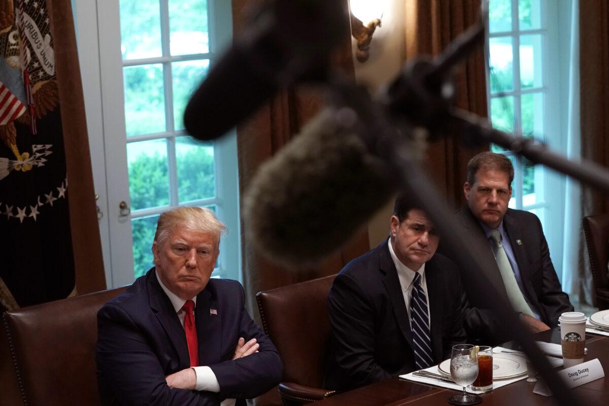 (L-R) U.S. President Donald Trump speaks as Arizona Gov. Doug Ducey and New Hampshire Gov. Chris Sununu listen during a working lunch with governors on “workforce freedom and mobility” at the Cabinet Room of the White House in Washington on June 13, 2019. (Alex Wong/Getty Images)