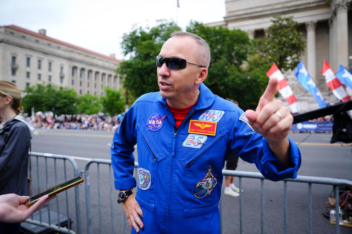 NASA Astronaut Randolph Bresnik, who will orbit the Moon in 2024 as part of the Artemis II program, speaks with the press at the Memorial Day Parade in Washington on May 29, 2023. (Madalina Vasiliu/The Epoch Times)