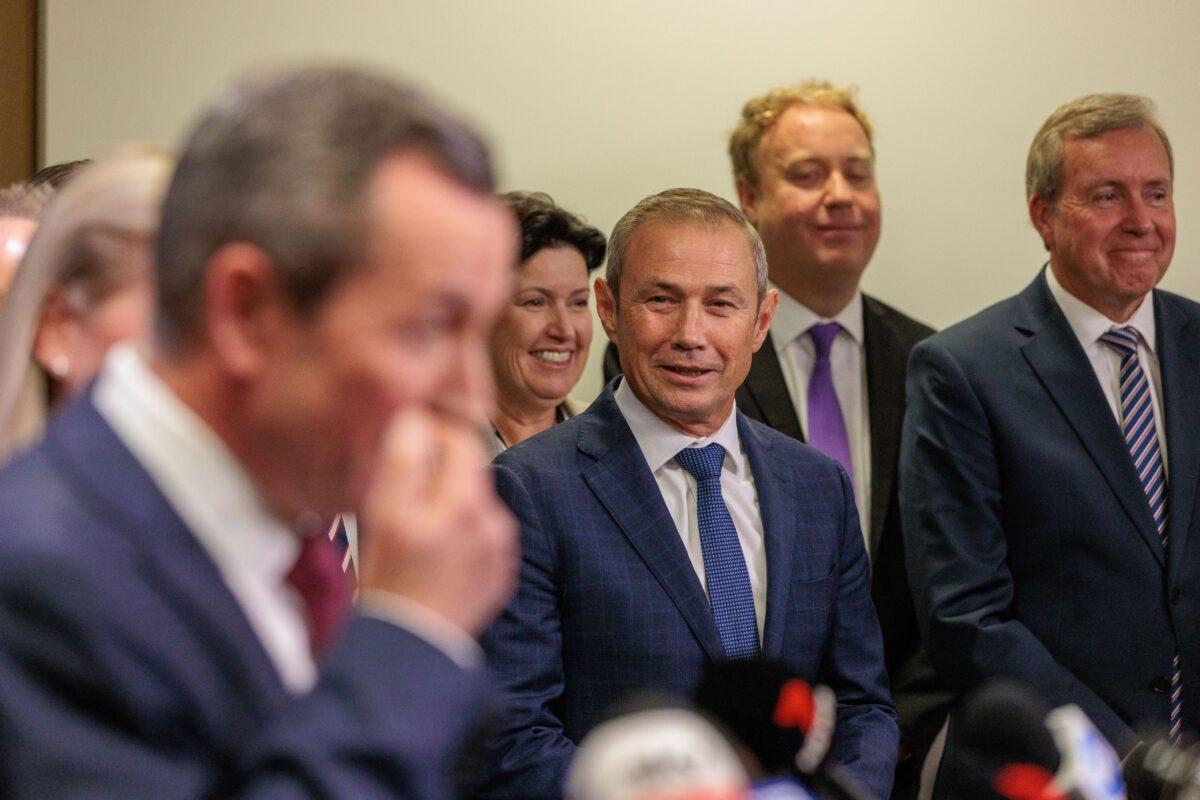WA Premier Roger Cook looks on as former Western Australian Premier Mark McGowan speaks to the media during a press conference at Dumas House in Perth, Australia, on May 29, 2023. (AAP Image/Richard Wainwright)