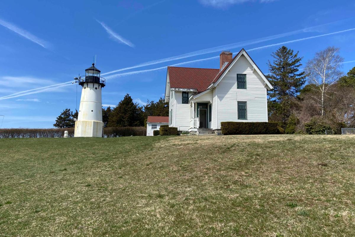 Warwick Neck Light, which dates to 1827 and was a one-time important navigation tool for mariners making their way to Providence, Rhode Island, stands near Narragansett Bay in Warwick, Rhode Island. (Barbara Salfity/General Services Administration via AP)
