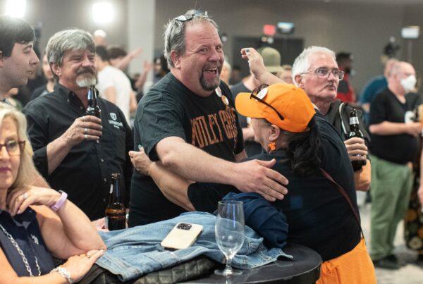 NDP supporters watch the results of the Alberta election in Edmonton on May 29, 2023. (The Canadian Press/Jason Franson)