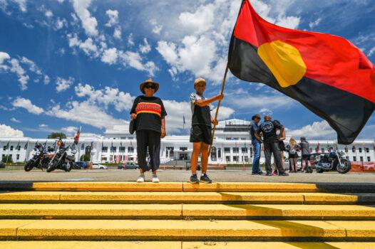 Local Indigenous Ngunnawal residents celebrate at the Aboriginal Tent Embassy in Canberra, Australia, on Jan. 26, 2023. (Martin Ollman/Getty Images)