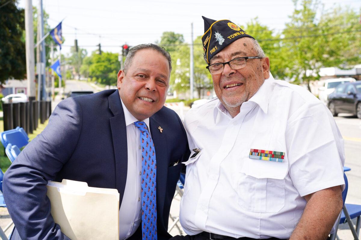 Town of Wallkill Supervisor George Serrano (L) and American Legion Post 1181 Commander Jim Scali during a Memorial Day ceremony at the Town of Wallkill Memorial Park in Middletown, N.Y., on May 29, 2023. (Cara Ding/The Epoch Times)