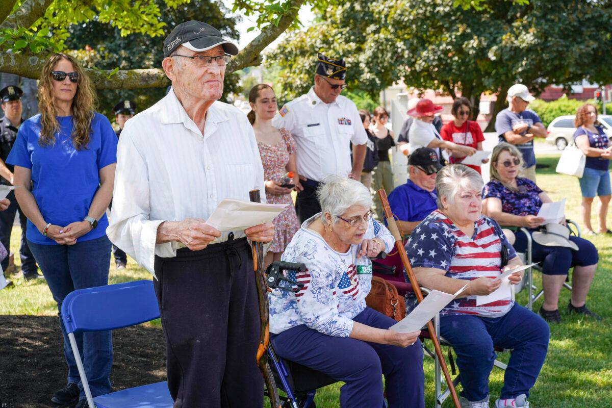 Residents sang the song 'God Bless America' during a Memorial Day ceremony at the Town of Wallkill Memorial Park in Middletown, N.Y., on May 29, 2023. (Cara Ding/The Epoch Times)