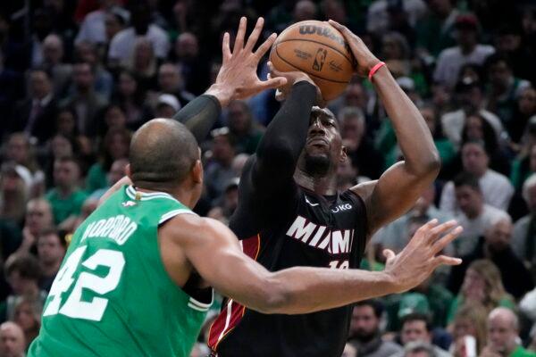 Miami Heat center Bam Adebayo (R) shoots as Boston Celtics center Al Horford defends during the second half in Game 7 of the NBA basketball Eastern Conference finals in Boston on May 29, 2023. (Charles Krupa/AP Photo)
