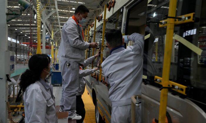 China Factory Activity Slows, Adding to Economic Strains