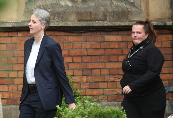 Kathleen Stock departs followed by security after her talk at the Oxford Union in Oxford, England, on May 30, 2023. (Eddie Keogh/Getty Images)