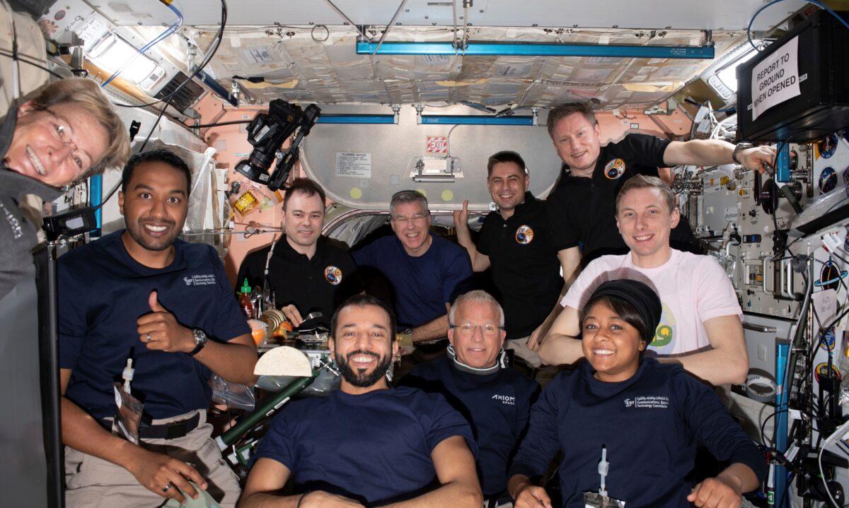 Axiom Mission-2 and Expedition 69 crew members gather for a portrait together during dinner time aboard the International Space Station on May 23, 2023. (NASA via AP)
