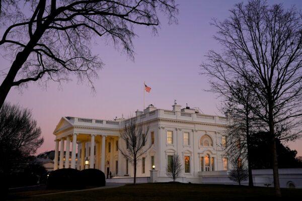 The White House is seen at sunset on President Joe Biden's first day in office on Jan. 20, 2021. (Erin Scott/Reuters)