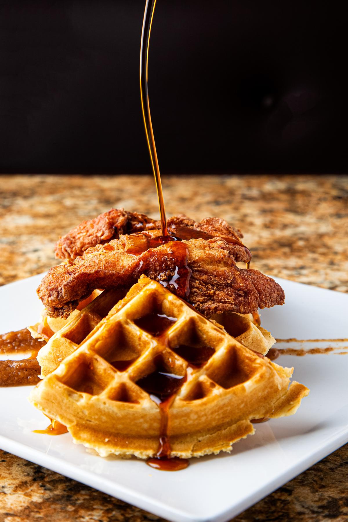 Chicken and waffles, served with rosemary-infused maple syrup and housemade apple butter. (Mark Manne Photography)