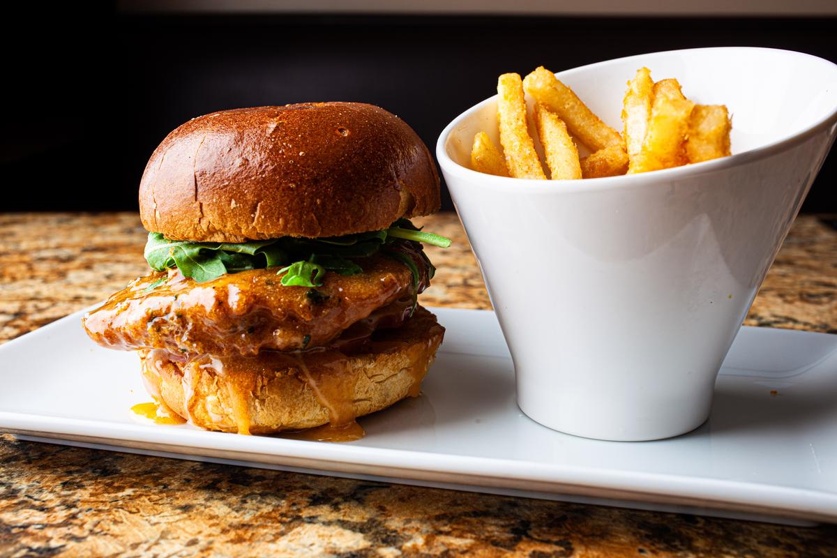 The 50Chicken Sandwich, slathered in a sweet and spicy honey sriracha sauce. (Mark Manne Photography)