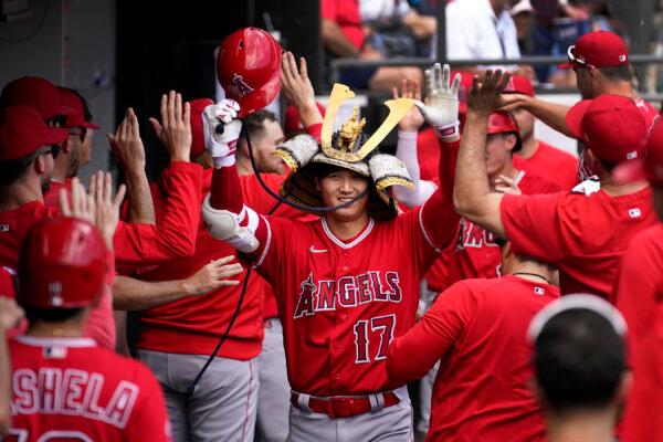 Los Angeles Angels' Shohei Ohtani celebrates in the dugout his second, two-run home run of the game off Chicago White Sox starting pitcher Lance Lynn during the fourth inning of a baseball game in Chicago on May 31, 2023. (Charles Rex Arbogast/AP Photo)