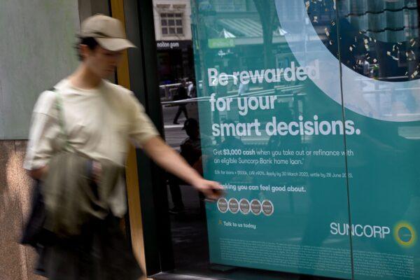 A man walks past a bank advertising home loans in Melbourne, Australia, on Feb. 7, 2023. (William West/AFP via Getty Images)