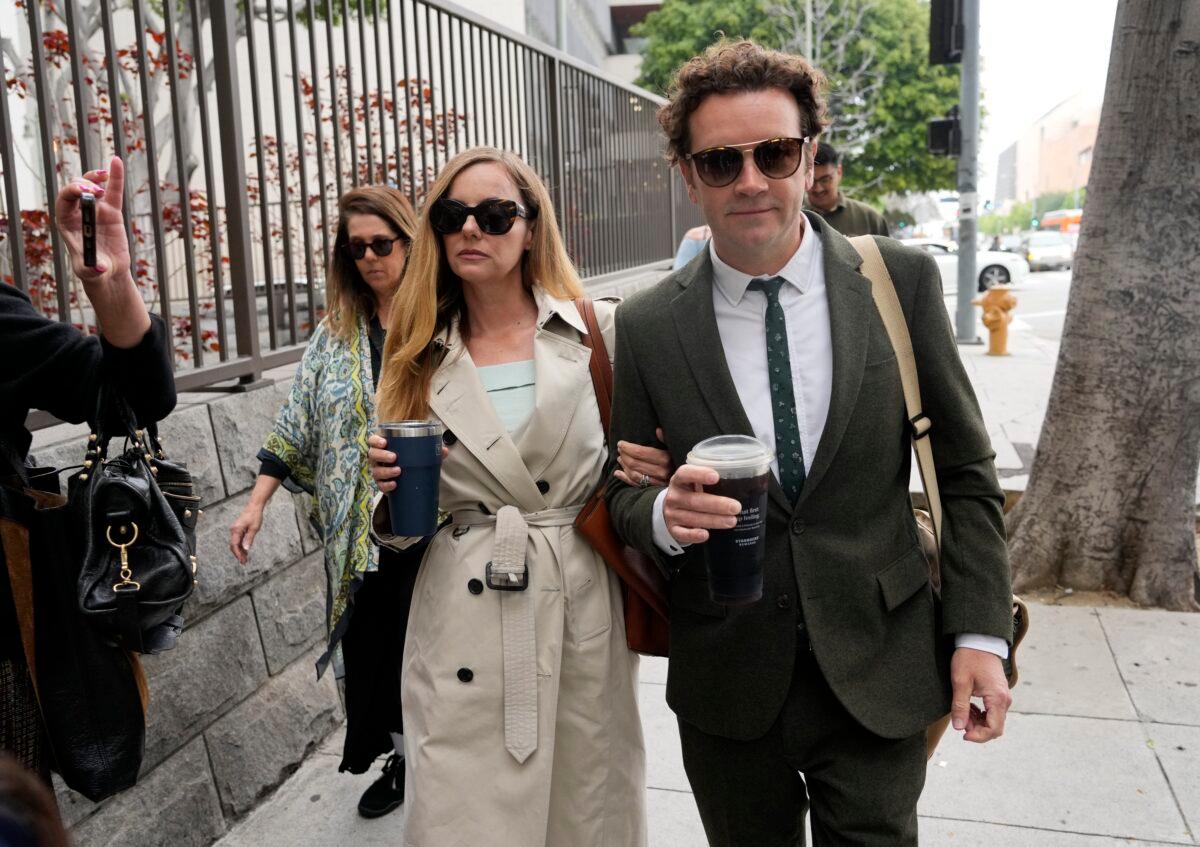 Danny Masterson (R) and his wife Bijou Phillips arrive for closing arguments in his second trial in Los Angeles on May 16, 2023. (Chris Pizzello/AP Photo)