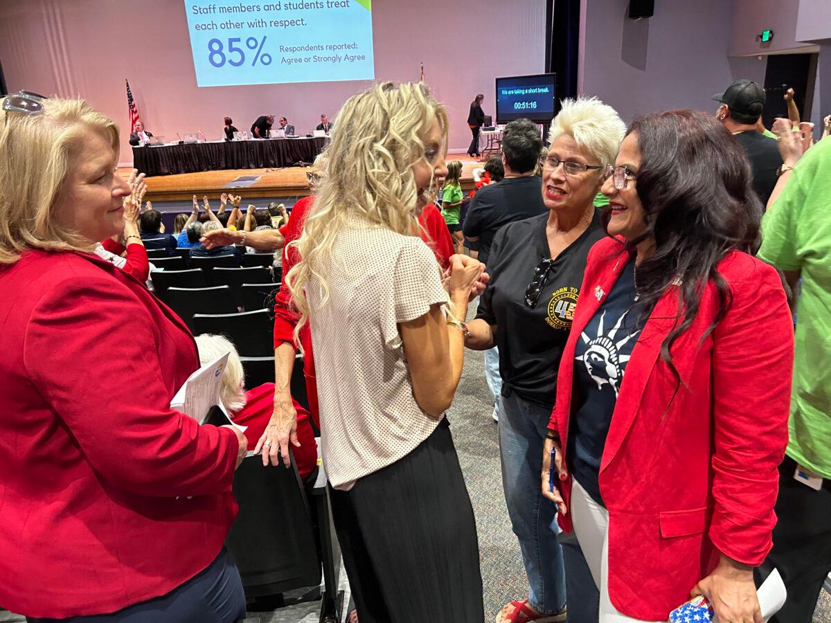 Hernando County School Board member Shannon Rodriguez (C) speaks to some of her supporters ahead of the May 30 meeting in the Hernando County High School theater. (Patricia Tolson/The Epoch Times)