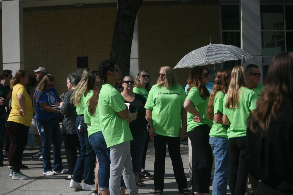 Teachers, administrators, and students wore matching green and yellow T-shirts in support of Hernando County School District Superintendent John Stratton in Hernando County, Fla., on May 30, 2023. (Patricia Tolson/The Epoch Times)