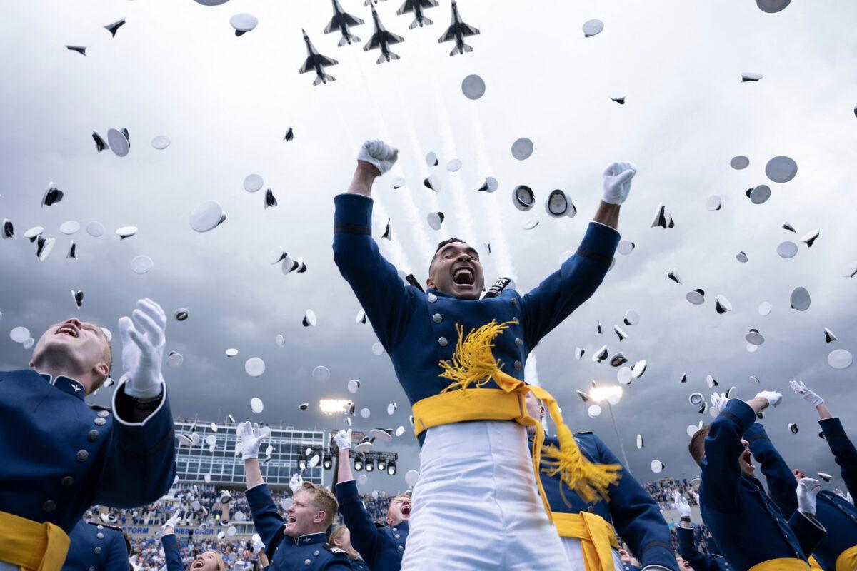 Cadets celebrate during their graduation ceremony at the U.S. Air Force Academy, just north of Colorado Springs in El Paso County, Colo., on June 1, 2023. (Brendan Smialowski/AFP via Getty Images)