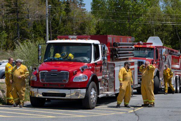 Firefighters arrive at a command centre within the evacuated zone while taking a break from battling the wildfire burning in Tantallon, N.S. outside of Halifax on Wednesday, May 31, 2023. (Darren Calabrese/The Canadian Press)