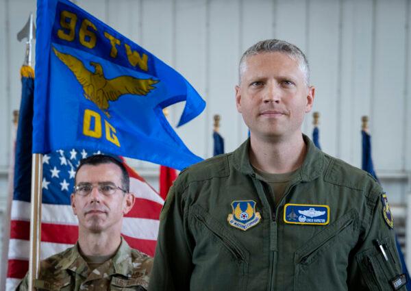 Col. Tucker Hamilton stands on the stage after accepting the 96th Operations Group guidon during the group’s change of command ceremony at Eglin Air Force Base, Florida, on July 26, 2022. (Courtesy U.S. Air Force photo/Samuel King Jr.)