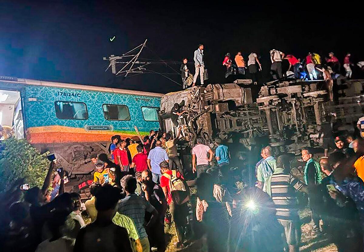 Rescuers work at the site of passenger trains that derailed in Balasore district, in the eastern Indian state of Orissa on June 2, 2023. (Press Trust of India via AP)