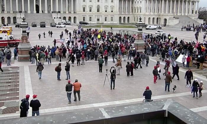 Protesters breach police lines on the east front of the Capitol on Jan. 6, 2021, seen from a Visitor's Center tower camera. (U.S. Capitol Police/Screenshot via The Epoch Times)