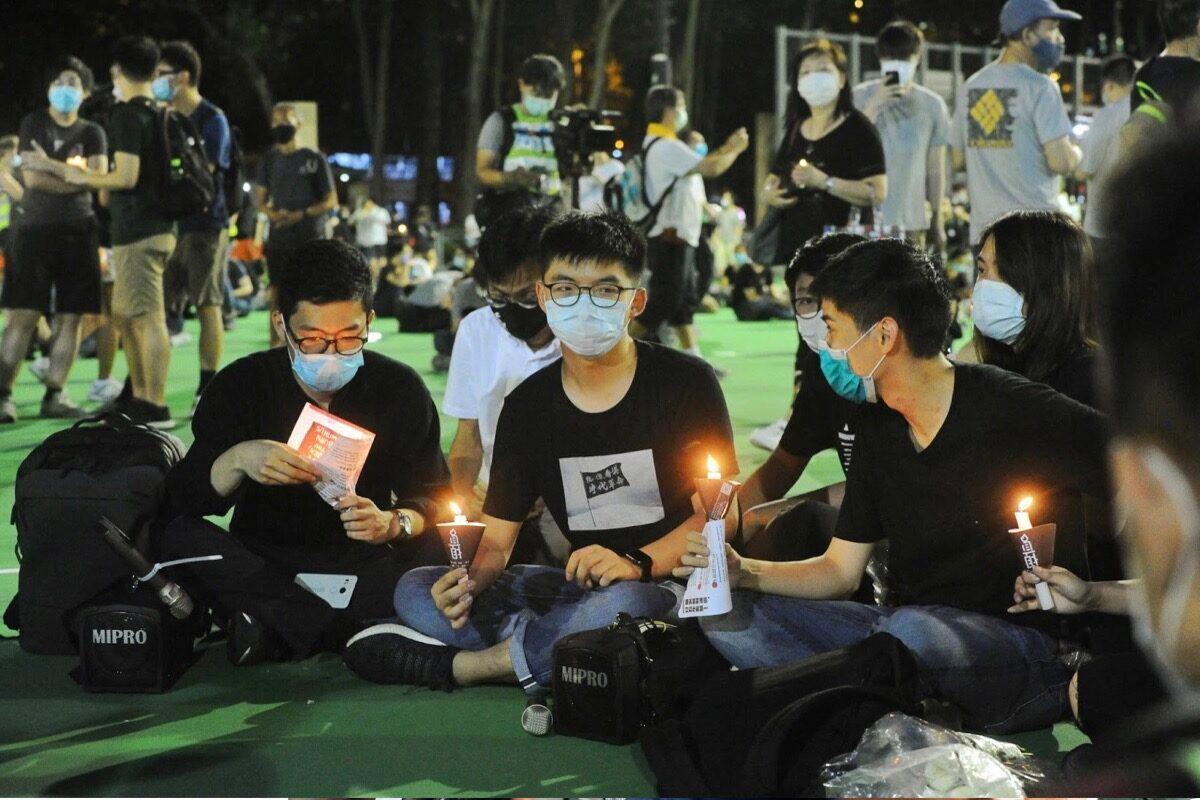 Nathan Law (L), Joshua Wong (2nd L), Sunny Cheung, Lester Shum, and others attend a candlelight vigil at Victoria Park in Hong Kong on June 4, 2020. (Sung Pi-lung/The Epoch Times)