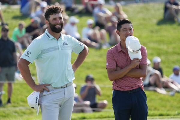 Jon Rahm of Spain and Collin Morikawa of the United States react on the 18th green during the second round of the Memorial Tournament presented by Workday at Muirfield Village Golf Club in Dublin, Ohio, on June 2, 2023. (Dylan Buell/Getty Images)