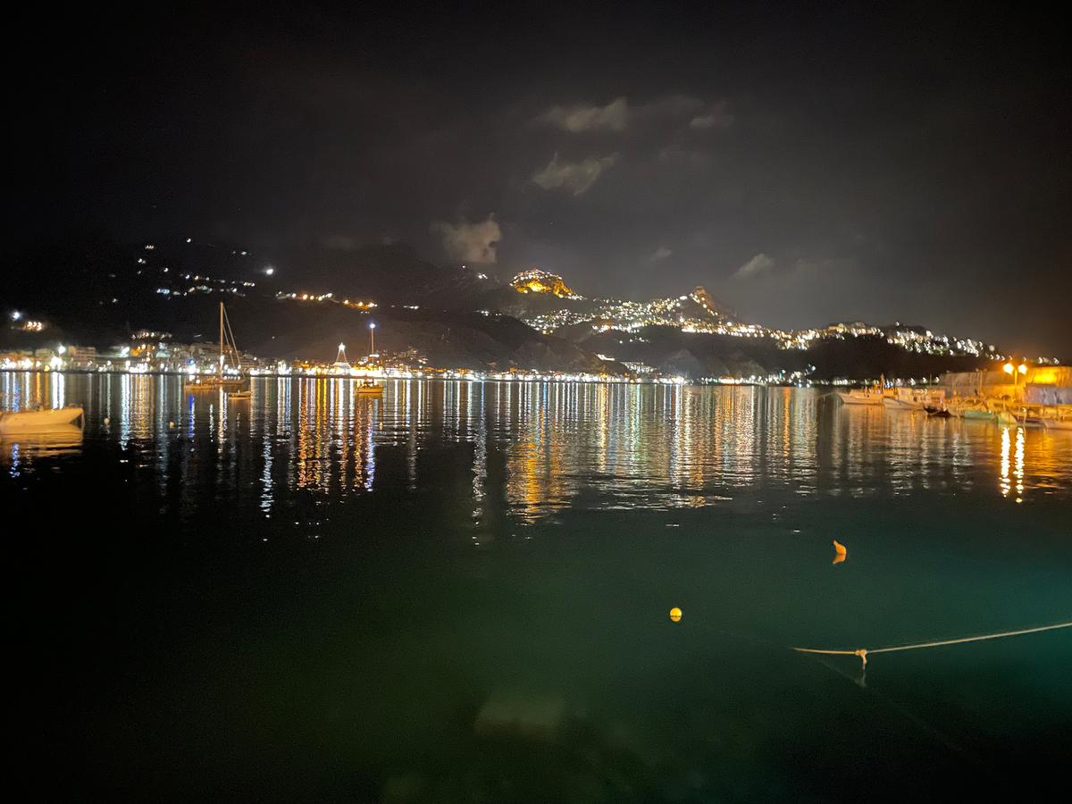 Taormina at night, as seen from across the bay in Giardini Naxos. (Jess Fleming/Pioneer Press/TNS)