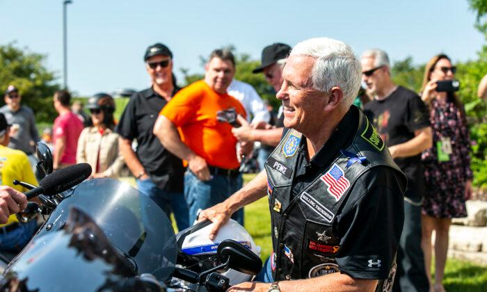 Former Vice President Mike Pence climbs onto his motorcycle during the “Roast and Ride” event, in Des Moines, Iowa, on June 3, 2023. (Joseph Cress/Iowa City Press-Citizen via AP)