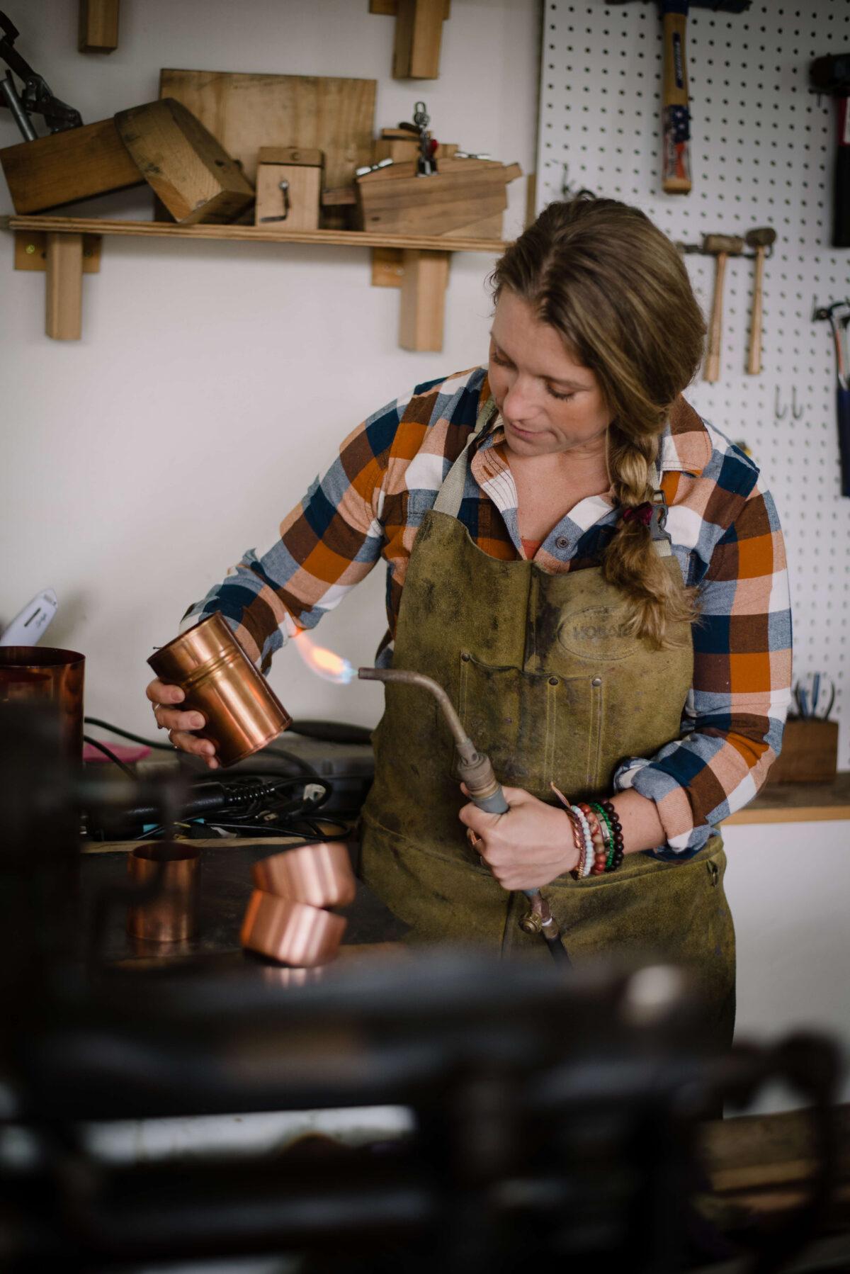 Dahmen sands, grinds, drills, rivets, hand-tins, buffs, and hand-polishes each piece at her home workshop in Wisconsin. (Courtesy of Sara Dahmen)
