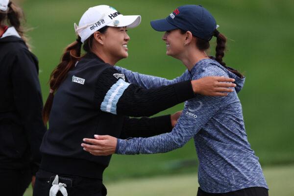 Minjee Lee of Australia (L) and Cheyenne Knight of the United States (R) hug on the 18th green during the third round of the Mizuho Americas Open at Liberty National Golf Club in Jersey City, N.J., on June 3, 2023. (Elsa/Getty Images)