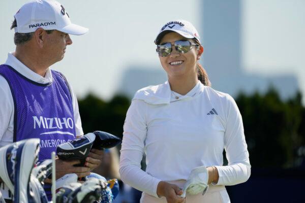 Rose Zhang smiles after hitting off the first tee during the first round of the Mizuho Americas Open golf tournament, at Liberty National Golf Course in Jersey City, N.J., on June 1, 2023. (John Minchillo/AP Photo)