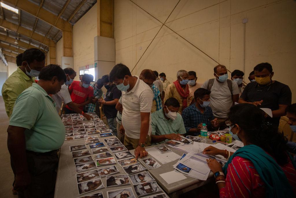 People try to identify missing family members from a train accident in Balasore, India, on June 4, 2023. (Abhishek Chinnappa/Getty Images)